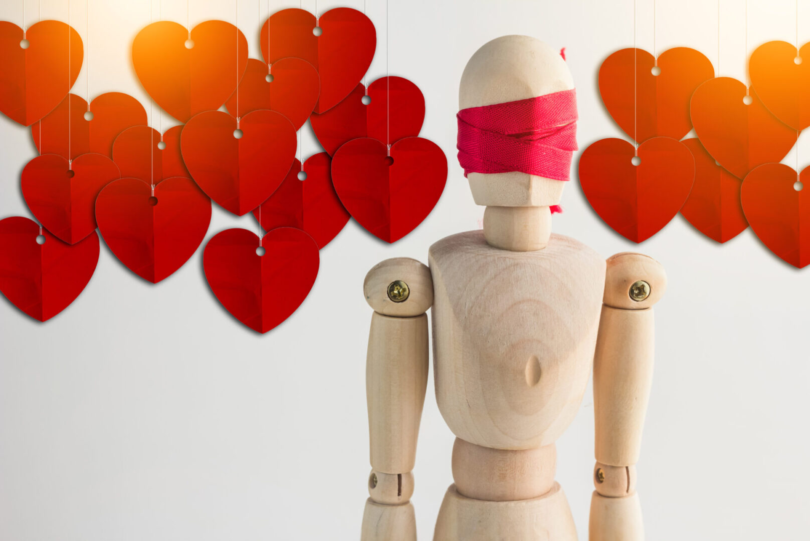 Wood,Man,Figure,Blind,With,Red,Ribbon,And,Red,Heart